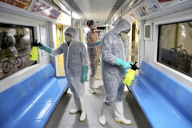 Workers disinfect subway trains against coronavirus in Tehran, Iran. Picture: AP Photo/Ebrahim Noroozi