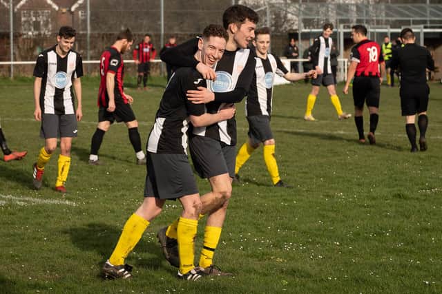 Hayling United won their last eight Hampshire Premier League games of 2019.20. Here, Jack Bishop is congratulated after scoring in the of them - a 5-0 victory at Locks Heath on March 15. Picture: Keith Woodland