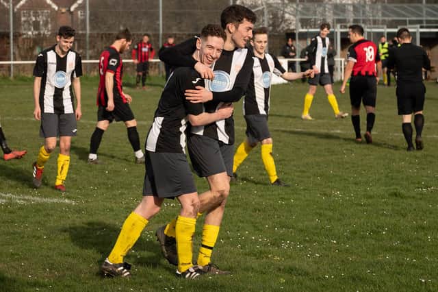 Hayling United won their last eight Hampshire Premier League games of 2019.20. Here, Jack Bishop is congratulated after scoring in the of them - a 5-0 victory at Locks Heath on March 15. Picture: Keith Woodland