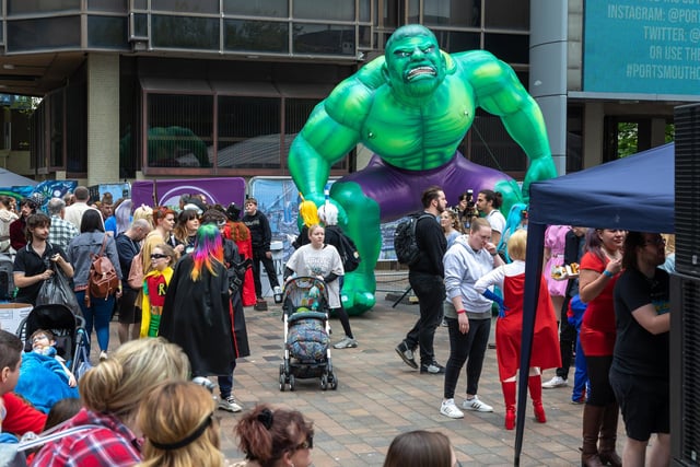 A giant inflatable Hulk towers over attendees at Portsmouth Comic Con 2022 at Portsmouth Guildhall