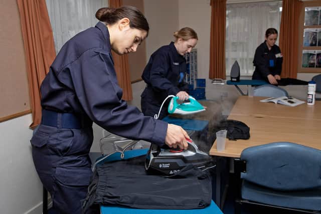Recruits at Fareham pictured ironing their kit for the first time. Photo: Royal Navy