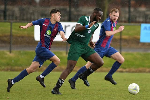 Teenager Josh Stream, left, gives chase against Brockenhurst.

Picture: Neil Marshall