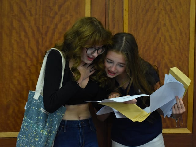 Phoebe Evans and Molly Tuck at Bay House collecting their GCSE results