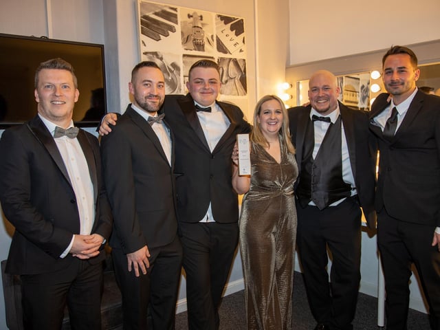 Winner of the Overall Business of the Year, Sara Woods, Michael Woods, James Taylor, Jason Clark and Alex Perkins of Solent Sky Services, with Sponsor James Ford or Solent Let.