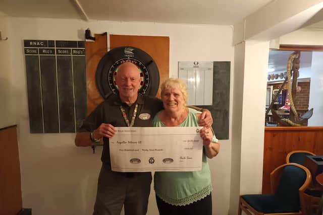 Members of the Waterlooville Royal Naval Association raise £534 for the Forgotten Veterans UK, received by Gary Sprakes.