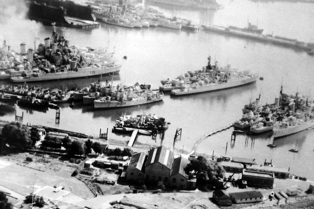 Part of the Royal Navys reserve fleet parked up off Whale Island in 1957.