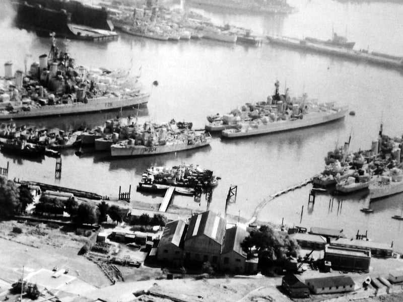 Part of the Royal Navys reserve fleet parked up off Whale Island in 1957.
