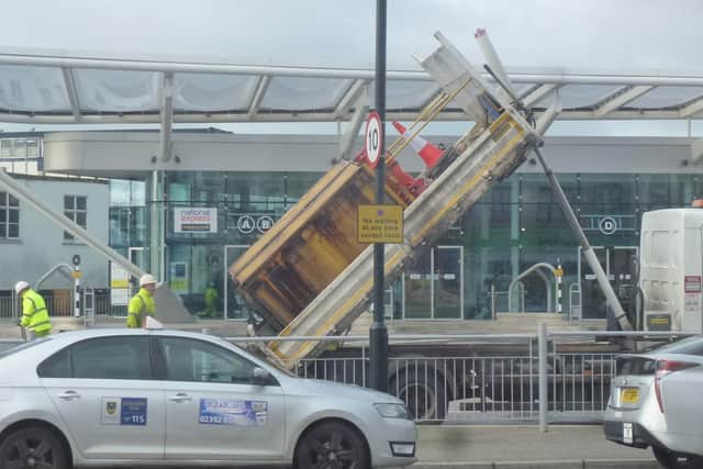 A previous photo of workers repairing the sinking surface of The Hard in 2020.