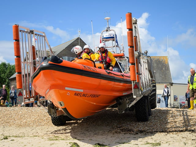Pictured is: The lifeboats are pushed down the beachPicture: Keith Woodland (260521-39)