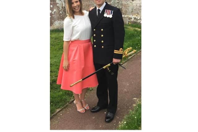 Lieutenant Commander Nathan Geddes is among those named on the Queen's Birthday Honours list for his time serving on HMS Defender, including during the Carrier Strike Group deployment. He is pictured with his wife, Nicole.