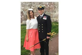 Lieutenant Commander Nathan Geddes is among those named on the Queen's Birthday Honours list for his time serving on HMS Defender, including during the Carrier Strike Group deployment. He is pictured with his wife, Nicole.