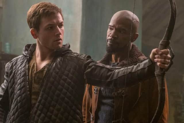 Taron Egerton and Jamie Foxx in Robin Hood.