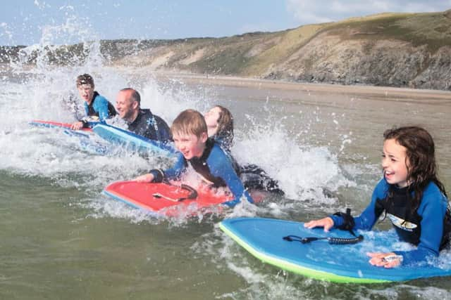 Surfing on the beach at Perranporth.