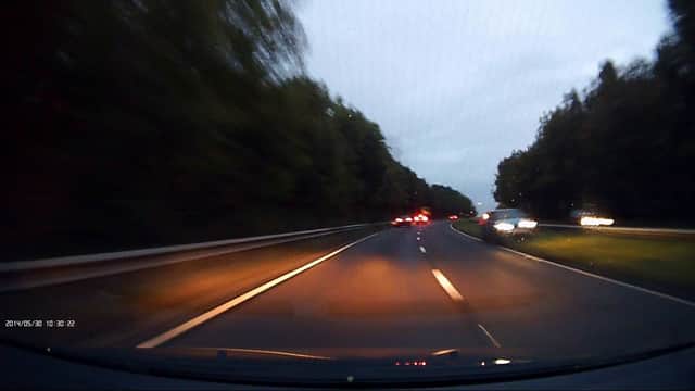 Dash cam footage shows how cars narrowly avoided colliding with what looks like a Range Rover when it careered into oncoming traffic (Photo: SWNS)