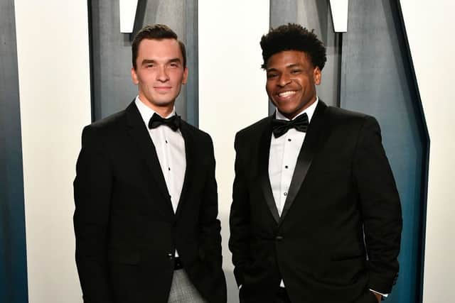 The TV star, pictured right, has been arrested on charges of producing child sex images (Photo: Getty Images)