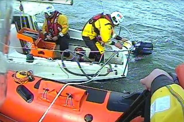 RNLI volunteers on the yacht
