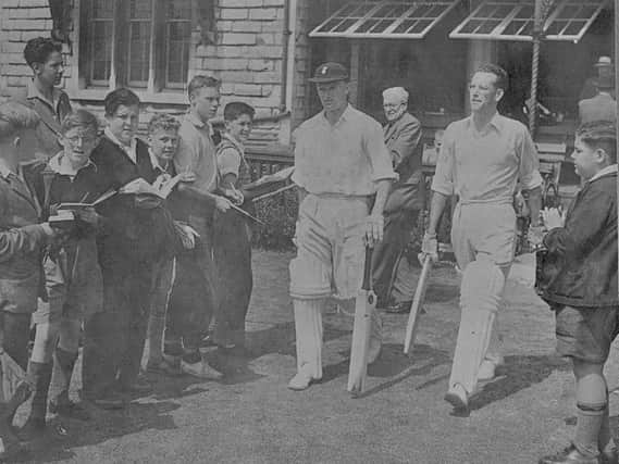 Hampshire's Jimmy Gray and Roy Marshall walk out to open the batting at Burnaby Road in a 1950s match