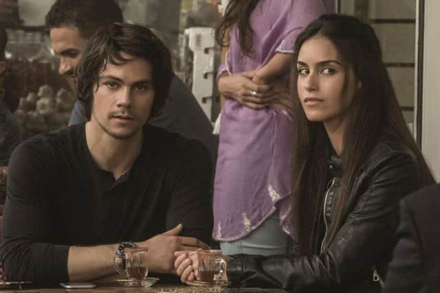 Dylan O'Brien as Mitch Rapp and Shiva Negar as Annika in American Assassin.