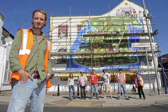 Artist Mark Lewis and and his team of volunteers restoring his landmark mural of Portsmouthin Clarendon Road, Southsea,  in 2012  
Picture: Ian Hargreaves (123017-2)