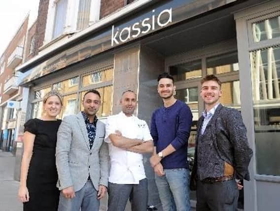 Kaz Miah, owner and head chef(middle) promising free curry at his Southsea restaurant if England win the World Cup. Picture: Johnston Press