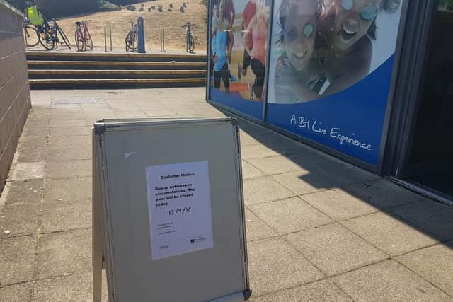 The sign citing the pool's closure today