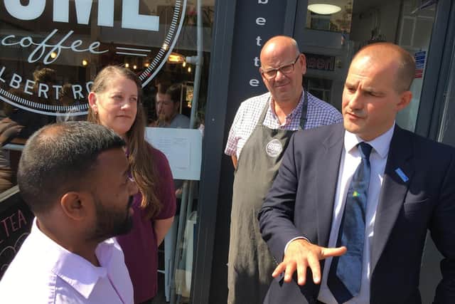 High streets minister Jake Berry, right, meets Jaf Ahmed from the Akash restaurant in Albert Road, Southsea