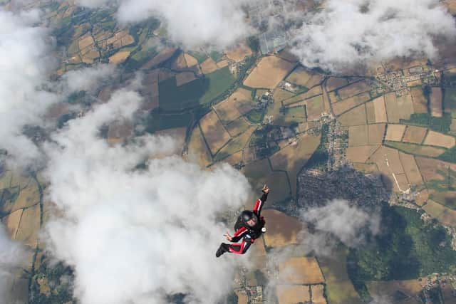 Skydivers leap out of a plane over Isle of Wight. Picture: Darrell Gibson
