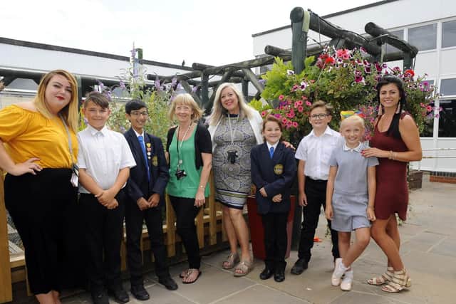 Retiring teacher Sally Heath (fourth from left) alongside the staff and children of Arundel Court Primary Academy