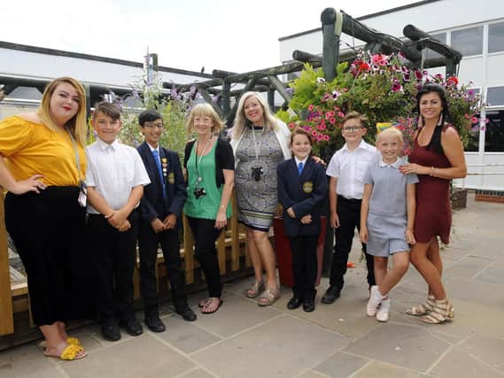 Retiring teacher Sally Heath (fourth from left) alongside the staff and children of Arundel Court Primary Academy