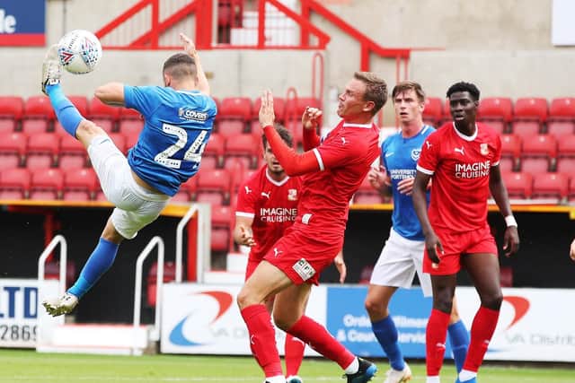 Conor Chaplin acrobatically fires at goal today at Swindon. Picture: Joe Pepler