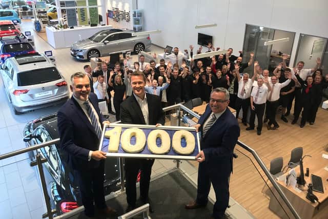 Peter Cooper Motor Group mark 1,000 years of experience with a cake baked by Darren Cooper's wife Charlie