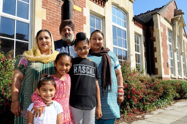 The Singh family outside Cumberland Infant School