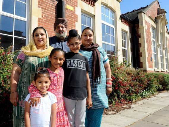 The Singh family outside Cumberland Infant School