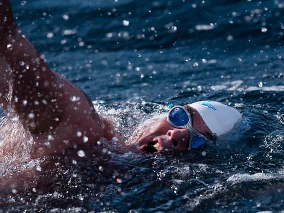 Renowned endurance swimmer Lewis Pugh near Eddystone Lighthouse during The Long Swim challenge on July 24. Picture: Kelvin Trautman