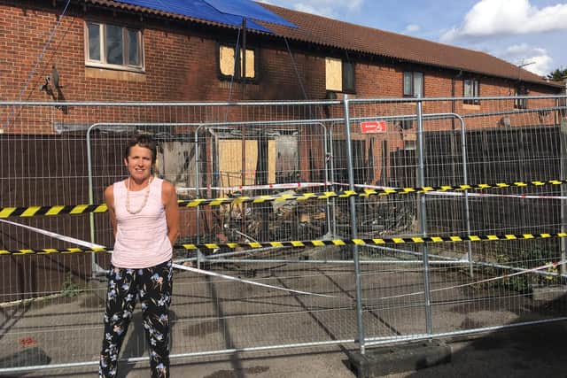 Sue Woodhead outside the gutted house