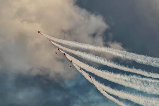 Red Arrows leaving a stream of clouds behind. Picture: Mark Rutley