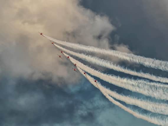 Red Arrows leaving a stream of clouds behind. Picture: Mark Rutley
