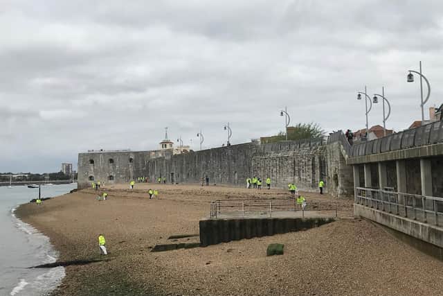 Volunteers get stuck into cleaning the beach behind the Hotwalls, in Old Portsmouth