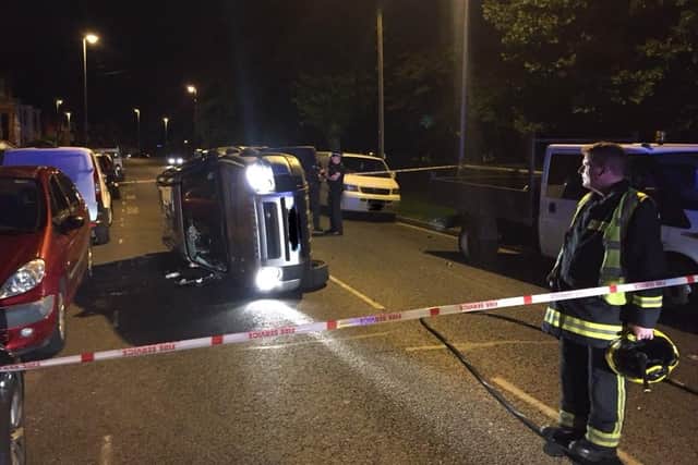 This silver Land Rover Freelander flipped at Northern Parade last night. Picture: Cosham Fire Station