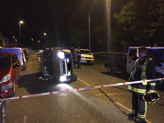 This silver Land Rover Freelander flipped at Northern Parade last night. Picture: Cosham Fire Station