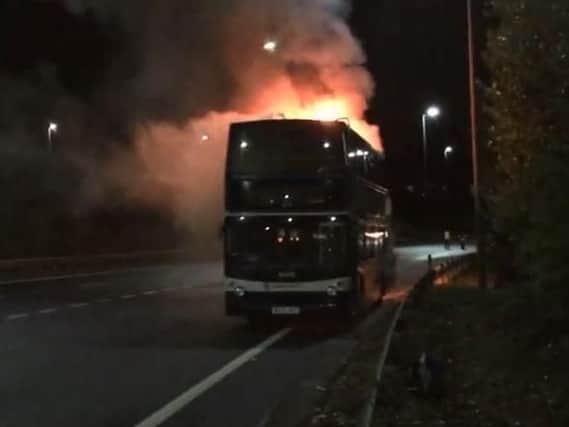 The double-decker bus in flames. Picture: Mark Waldron