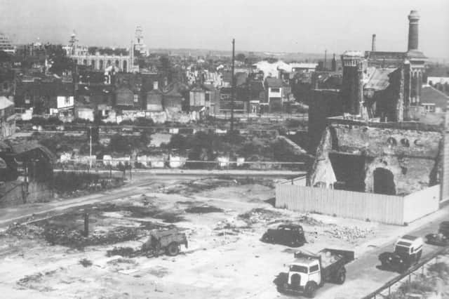 An area of Portsmouth, south of the Guildhall, several years after the Second World War yet still covered with bomb sites where unscrupulous car salesmen would dispose of their wrecks. Picture: Anthony Triggs.