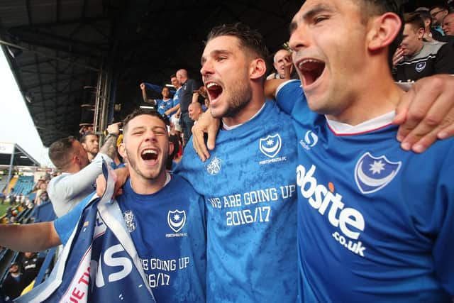Conor Chaplin celebrates the League Two title with Gareth Evans and Gary Roberts. Picture: Joe Pepler