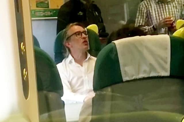 Steve Coogan in discussion with the ticket inspector (Photo: SWNS)