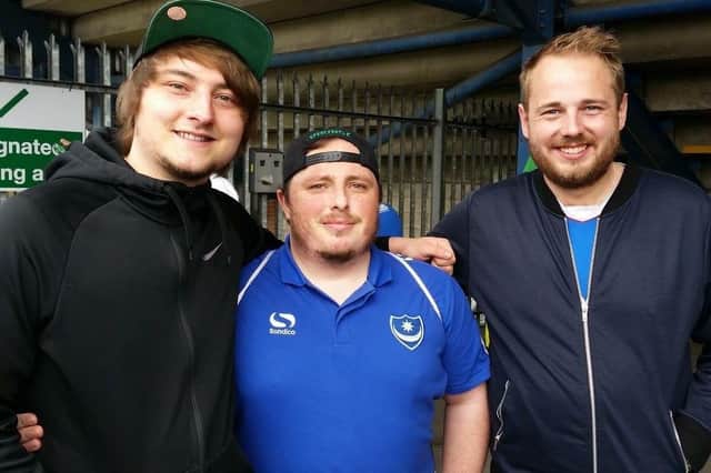 Ryan Stillwell (middle) who has won free hotel stays for away games this season with his friends Mikey Everett (left) and Tom Clements (right)