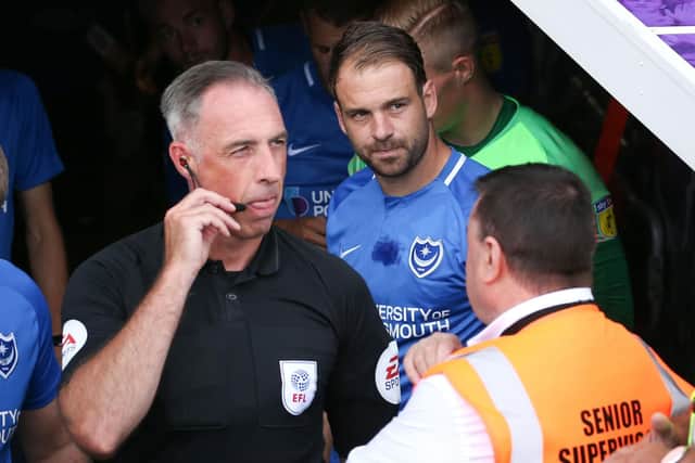 Brett Pitman prepares to lead Pompey out against Luton on the opening day of the season