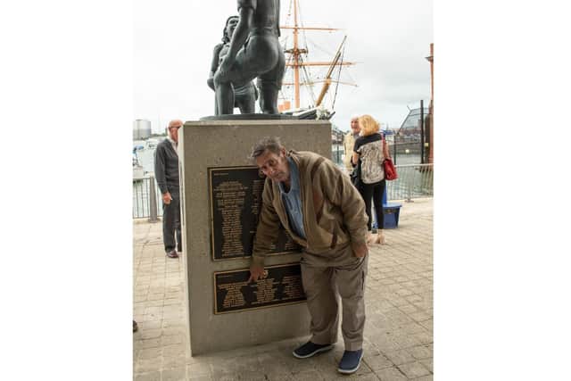 Alexander Baldacchino, pointing to his name of the new and 'final' plaque at the Mudlarks' Memorial in Portsea. Picture: Polly Richards
