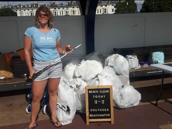Shanelle Kholer from Seen Bin, Sea Change with some of the rubbish collected at Southsea