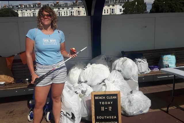 Shanelle Kholer from Seen Bin, Sea Change with some of the rubbish collected at Southsea