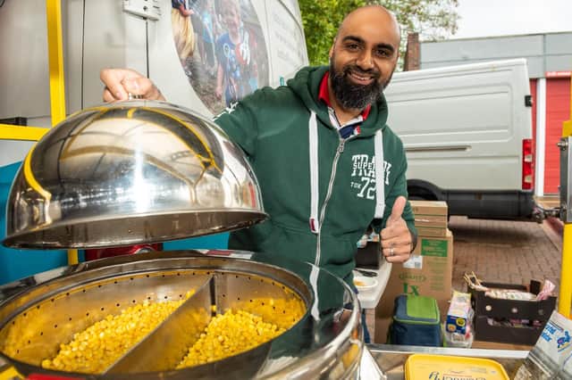 Zay Ahmed with his sweet corn stall at Southsea fire station's fun day marking International Day of Peace Picture: Vernon Nash (180433-012)